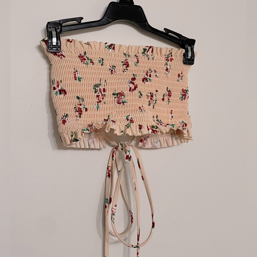 light pink baithing suit top with flowers and removable padding